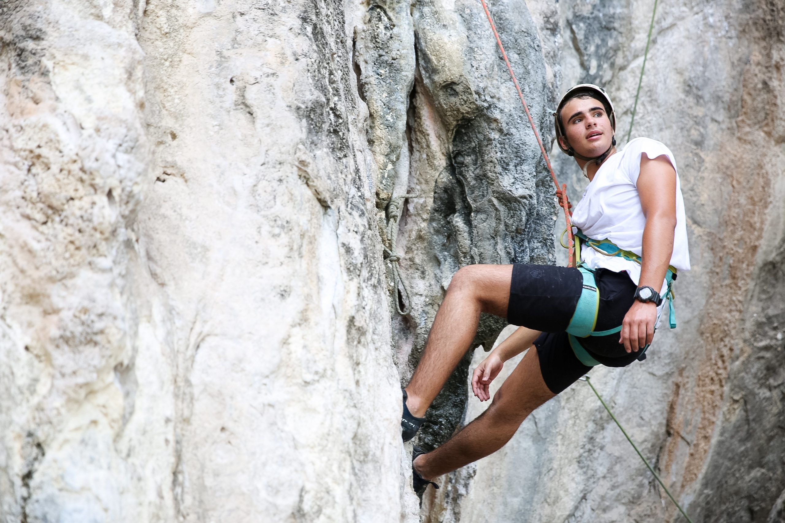 Student rock climbing in Thailand.