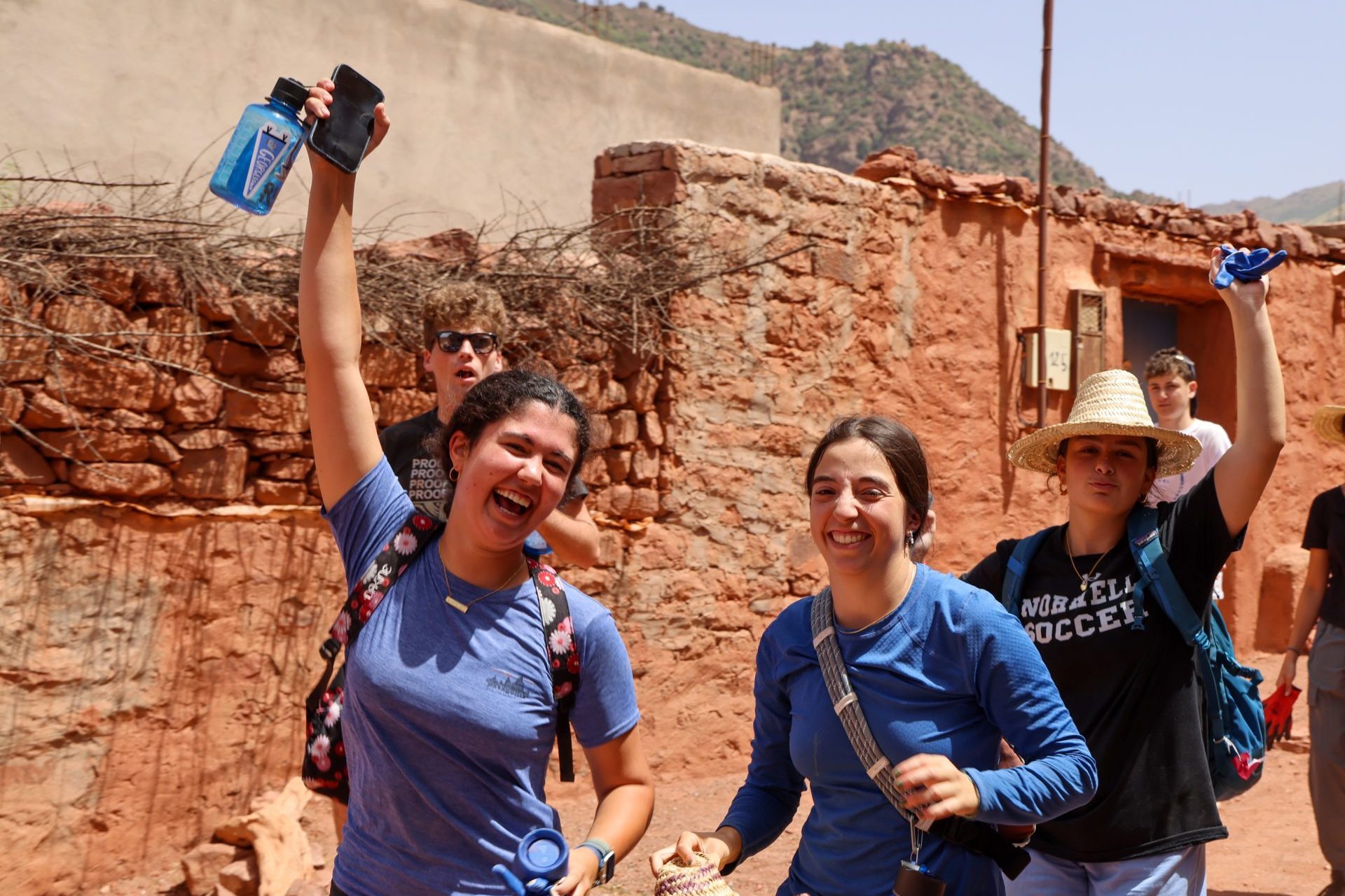 Morocco Student Travel and Service Programs for Teens: A group explores village streets, showing why high school students choose Morocco for immersive cultural travel.