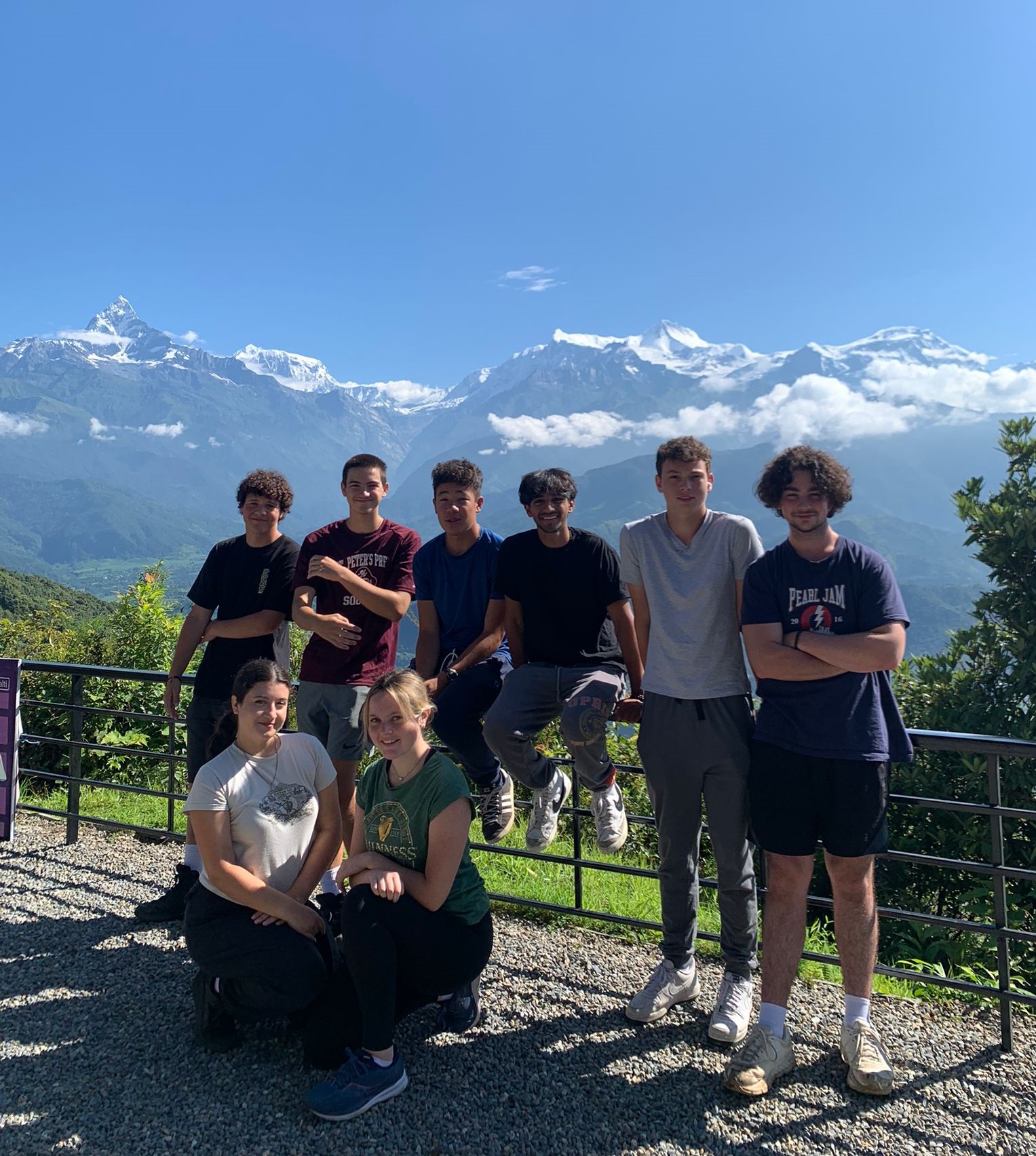 Rustic Pathways students gather near the zipline in Nepal.