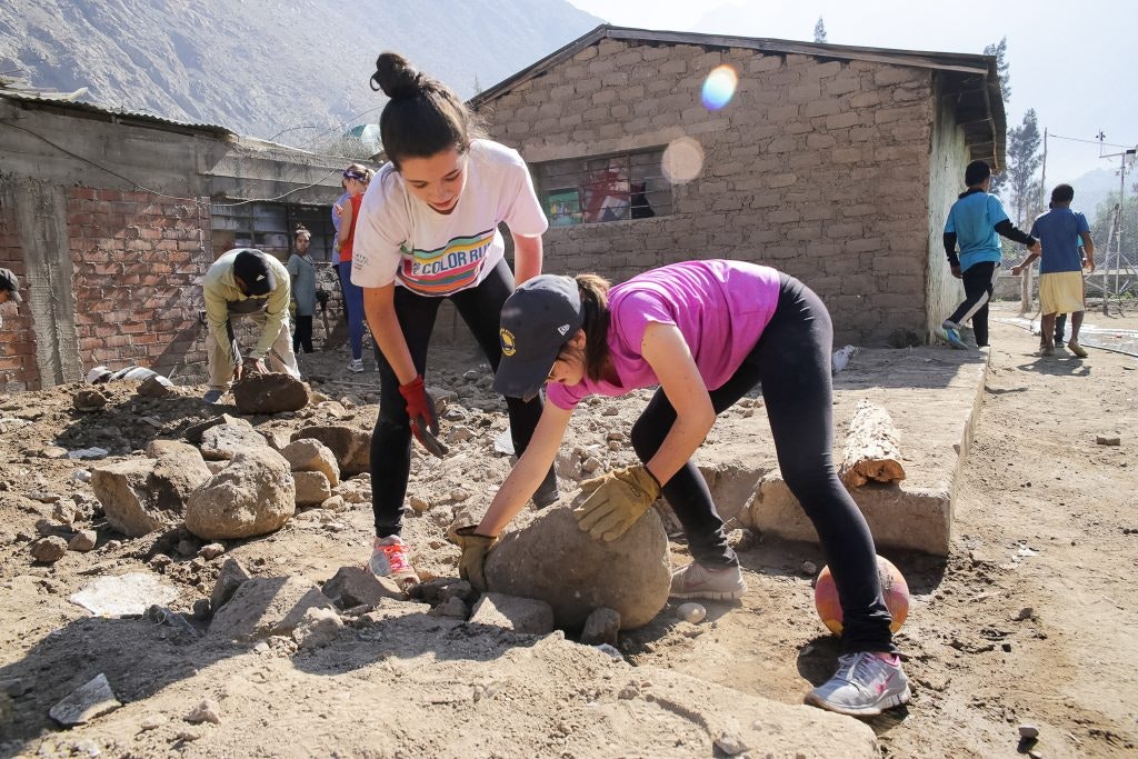 Teen travelers working on a community service project during a Rustic Pathways Peru teen tour