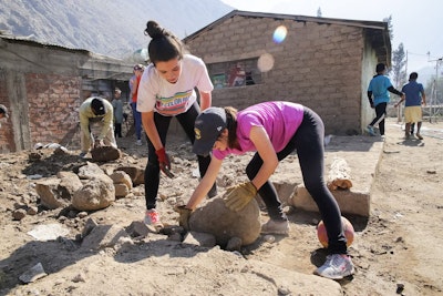 Teen travelers working on a community service project during a Rustic Pathways Peru Teen Tour