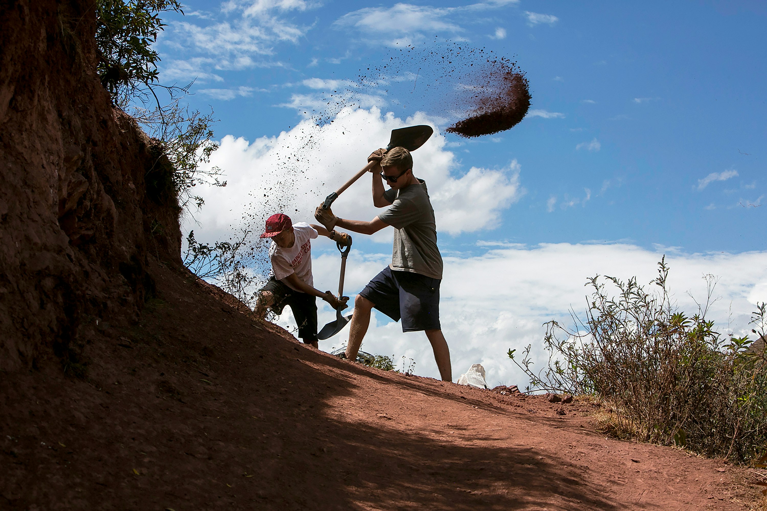 Students digging as part of a service project.