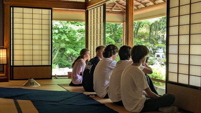 Students participating in cultural reflection at a traditional Japanese house during a teen travel program to Tokyo