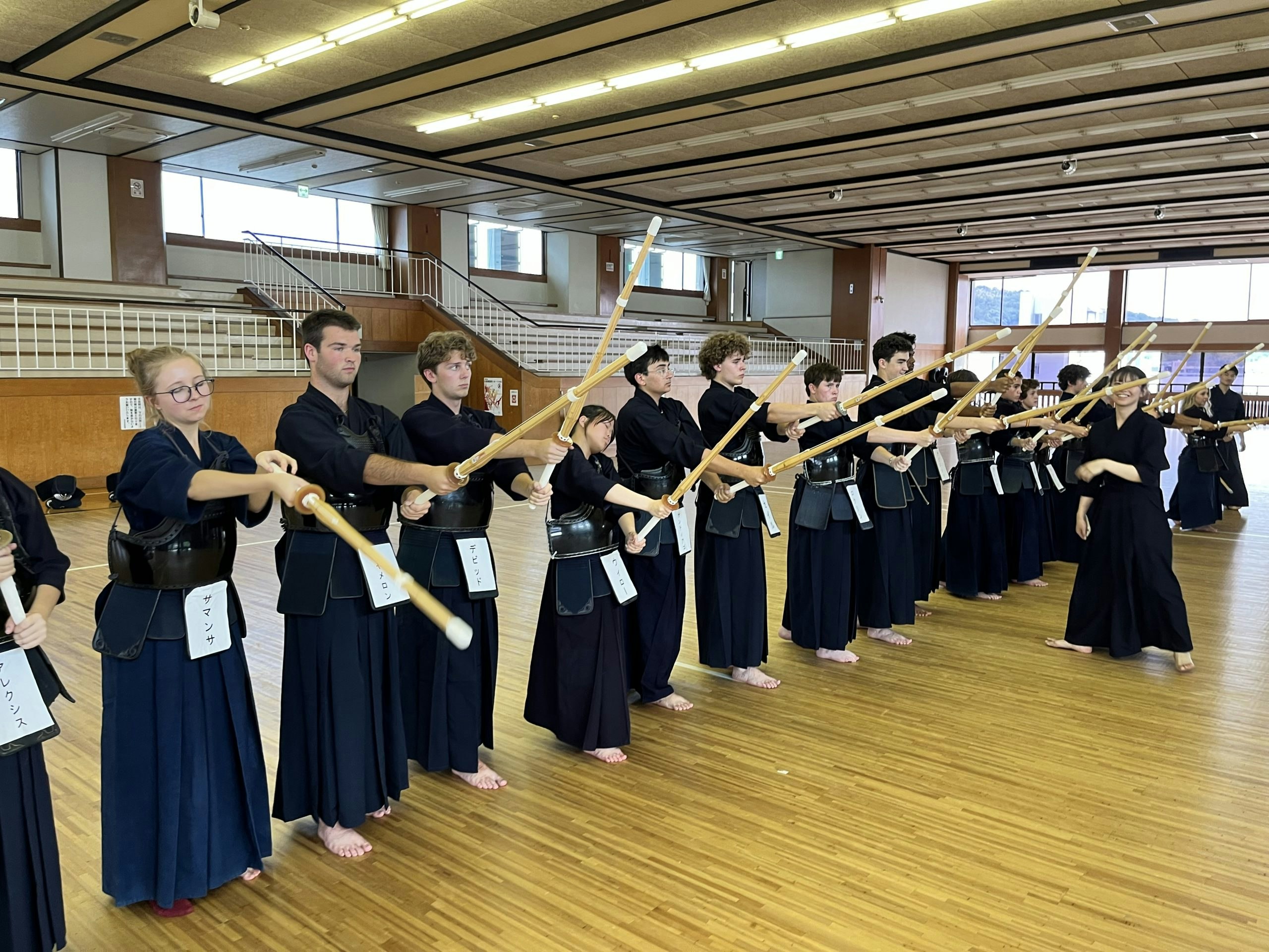 teen travelers in japan practicing Kendo