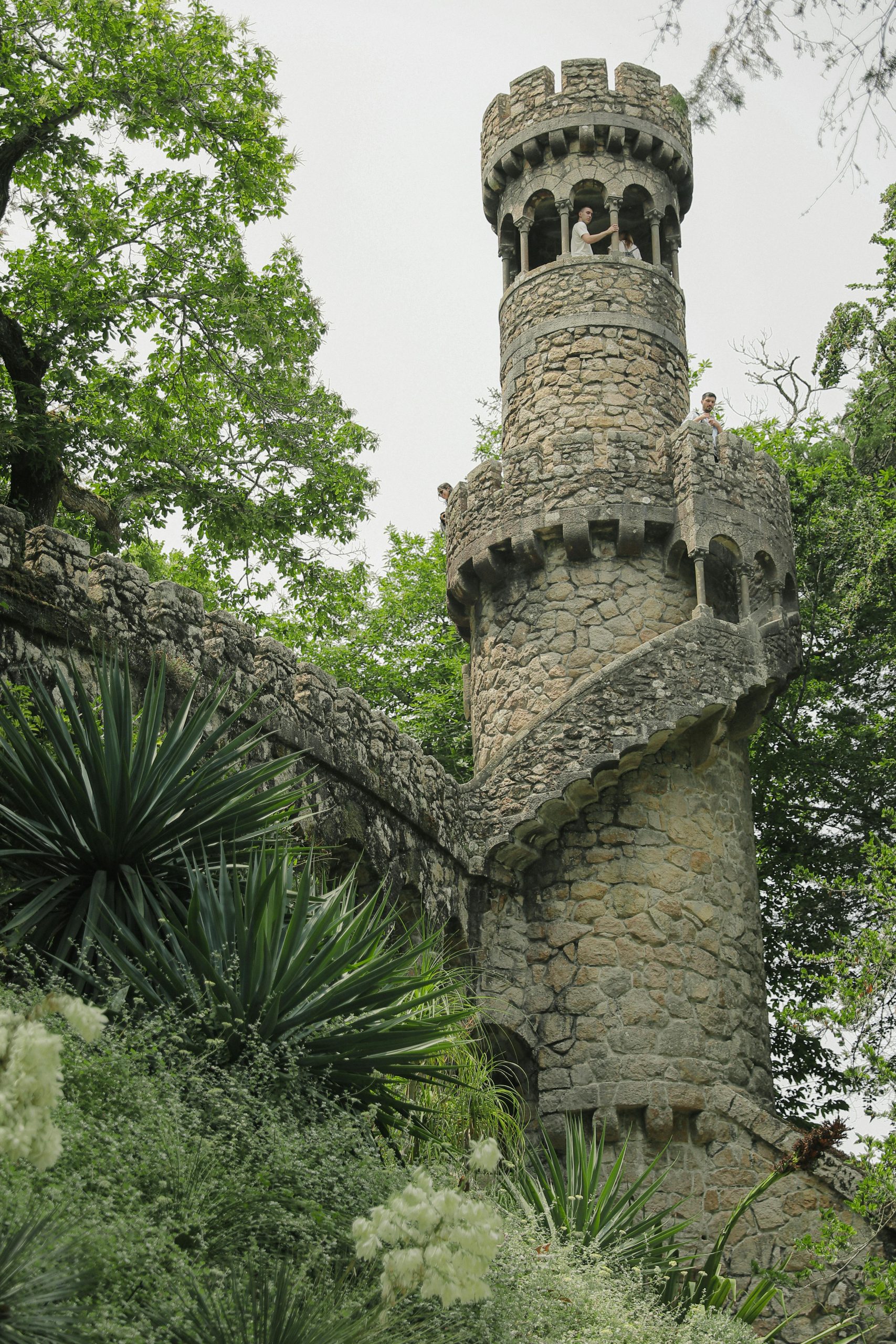 Castle in Portugal with person at the top of the stairs.