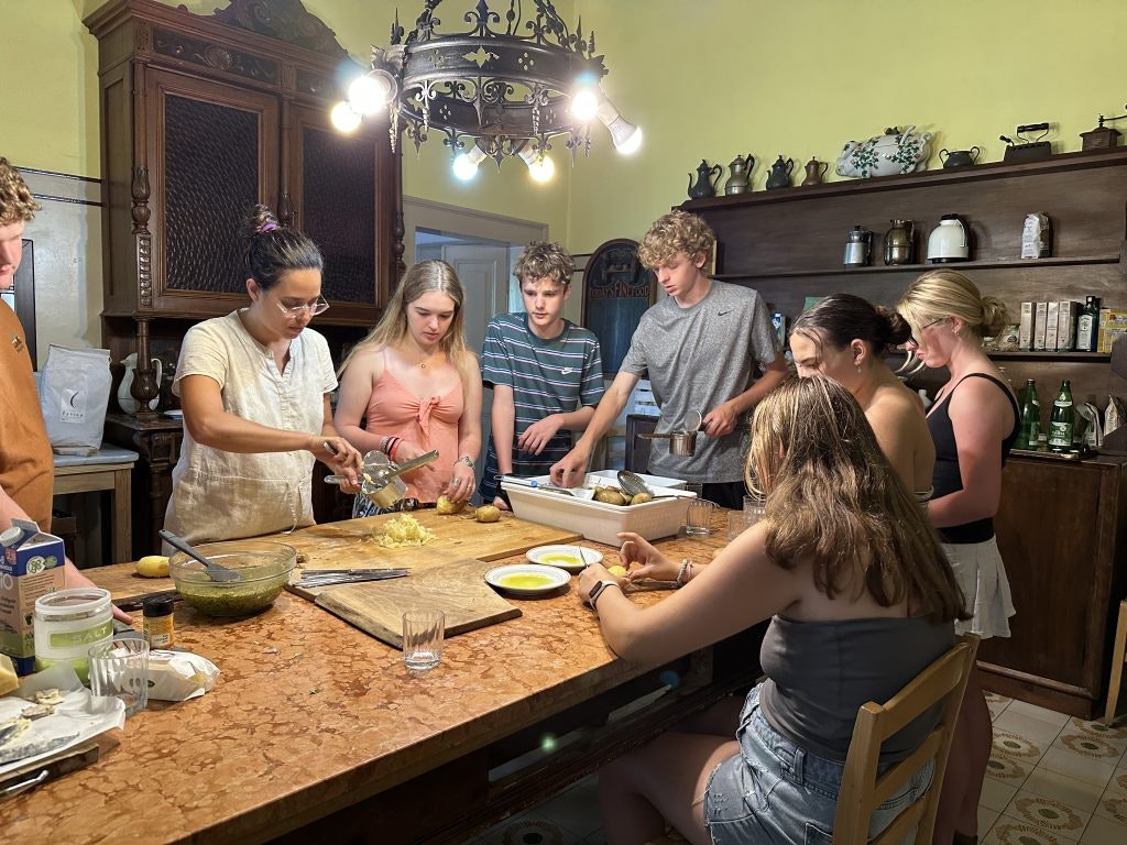 Rustic Pathways students learn how to make pasta while in Italy.