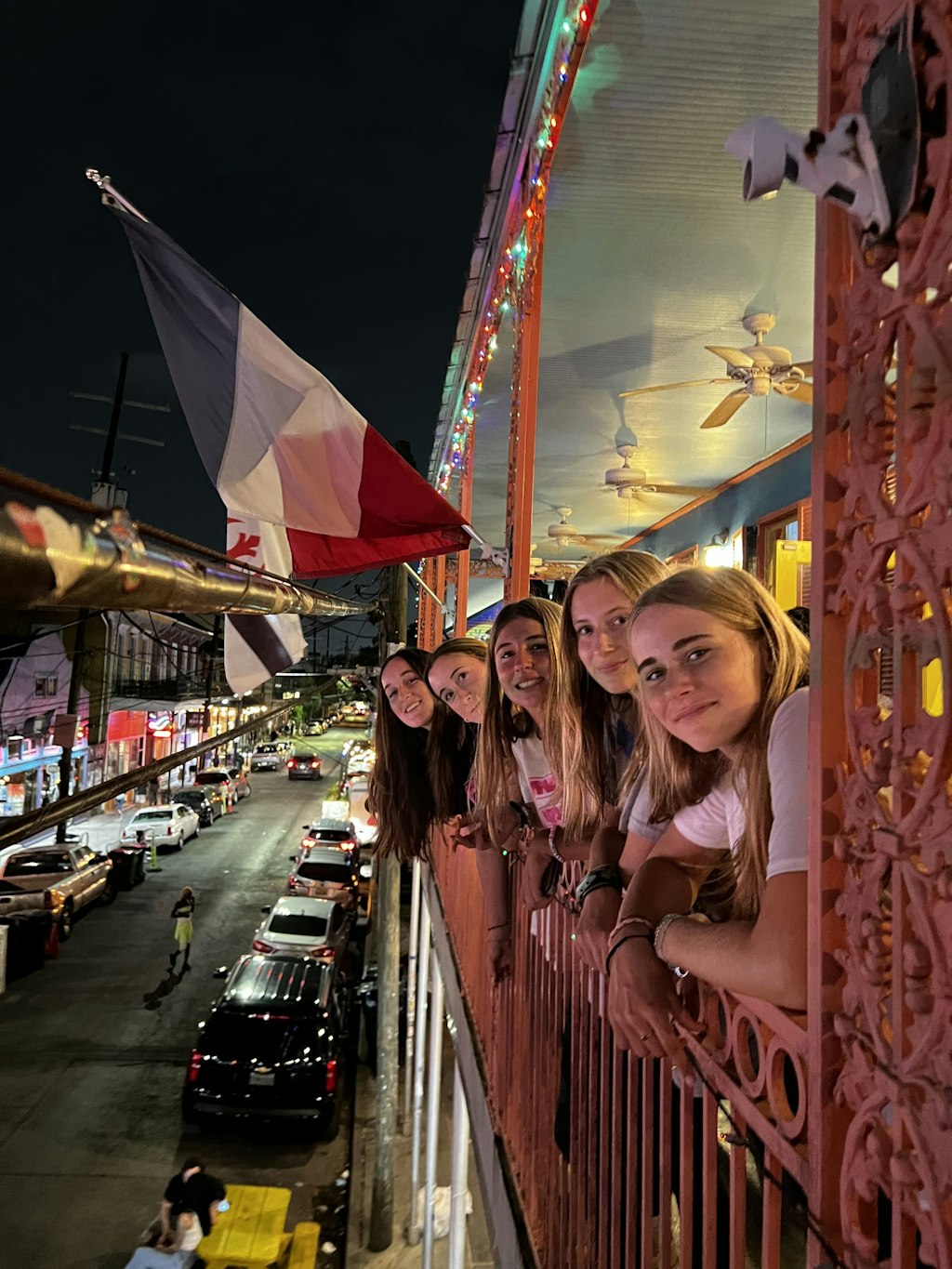 Group of students overlooking Bourbon Street in New Orleans during a Rustic Pathways volunteer abroad vs internship travel experience exploring cultural learning and leadership.