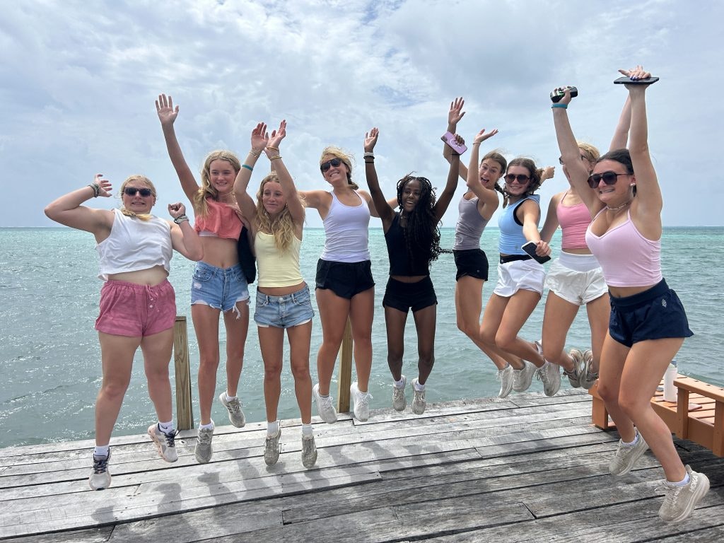 Summer program in Belize for high school students with Rustic Pathways on a pier next to the ocean in the Caribbean.