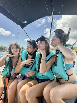 a group of students in lifejackets get ready to snorkel on a Dominican Republic teen tour