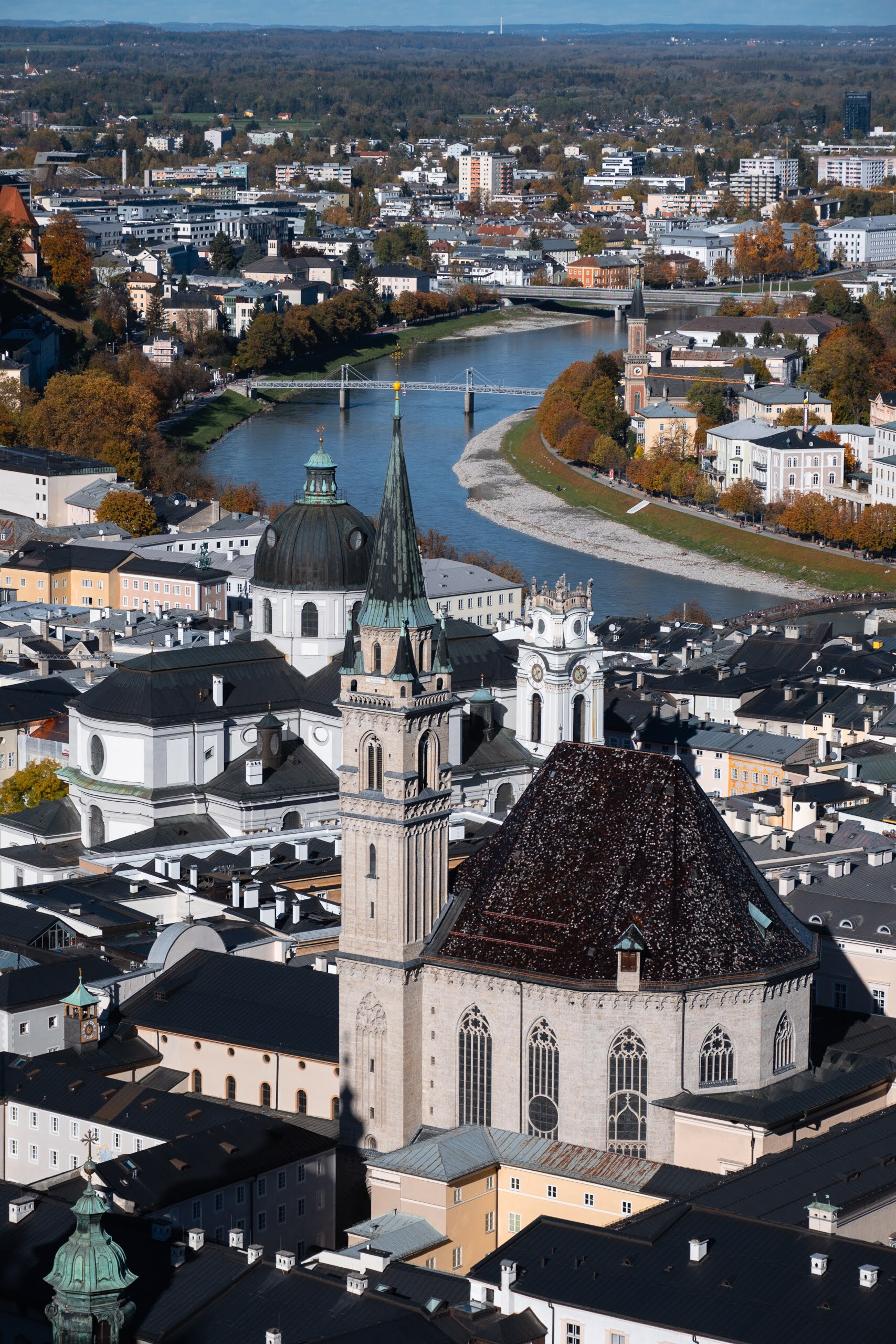 Aerial view of a historic European city with a winding river.