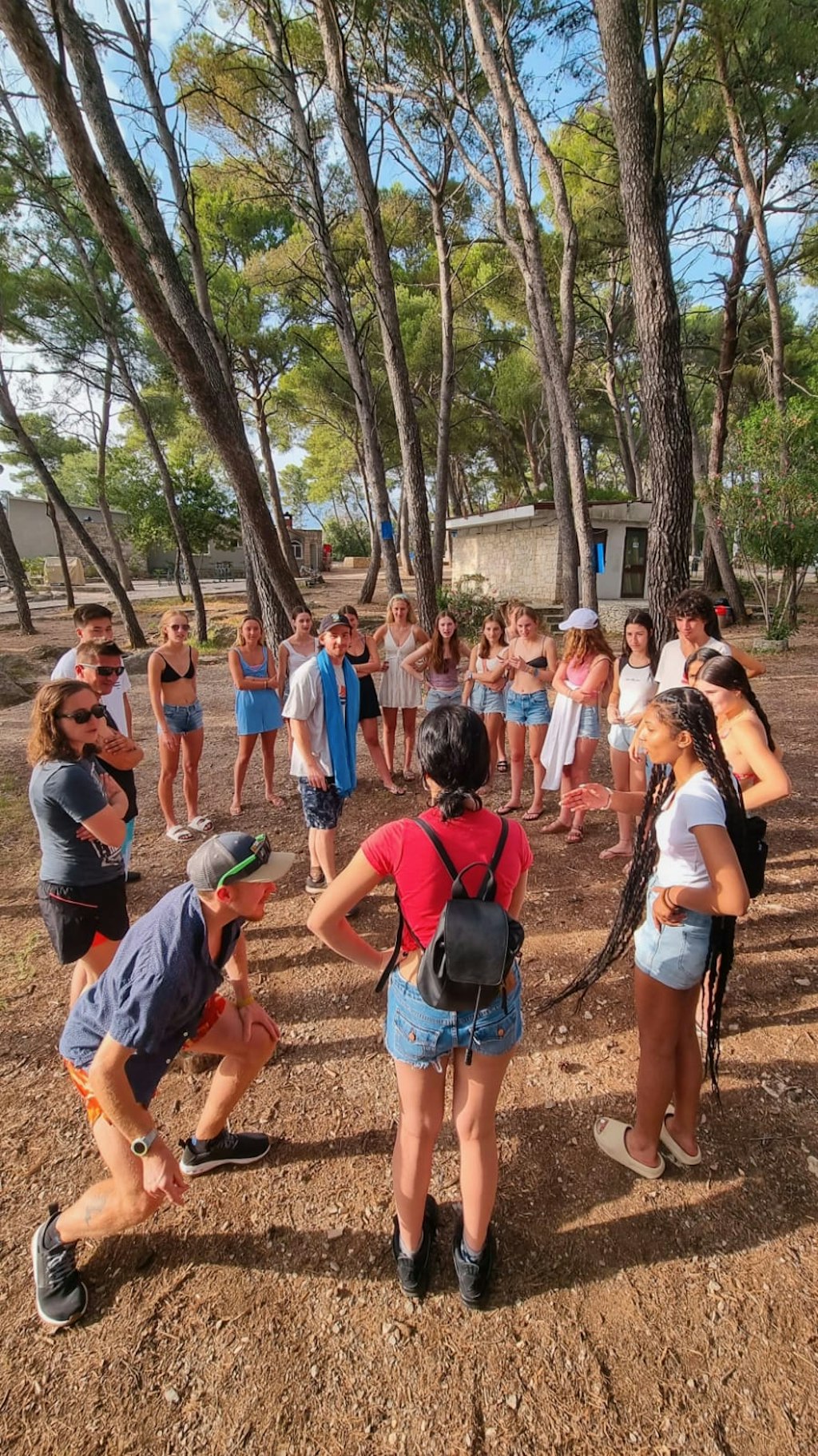 Group of students participating in outdoor team-building activities during a Rustic Pathways spring break volunteer abroad program