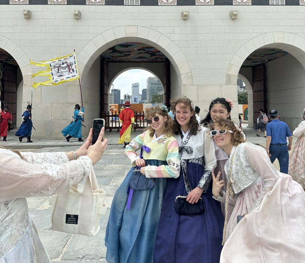 Girls in Hanboks in front of the Palace.