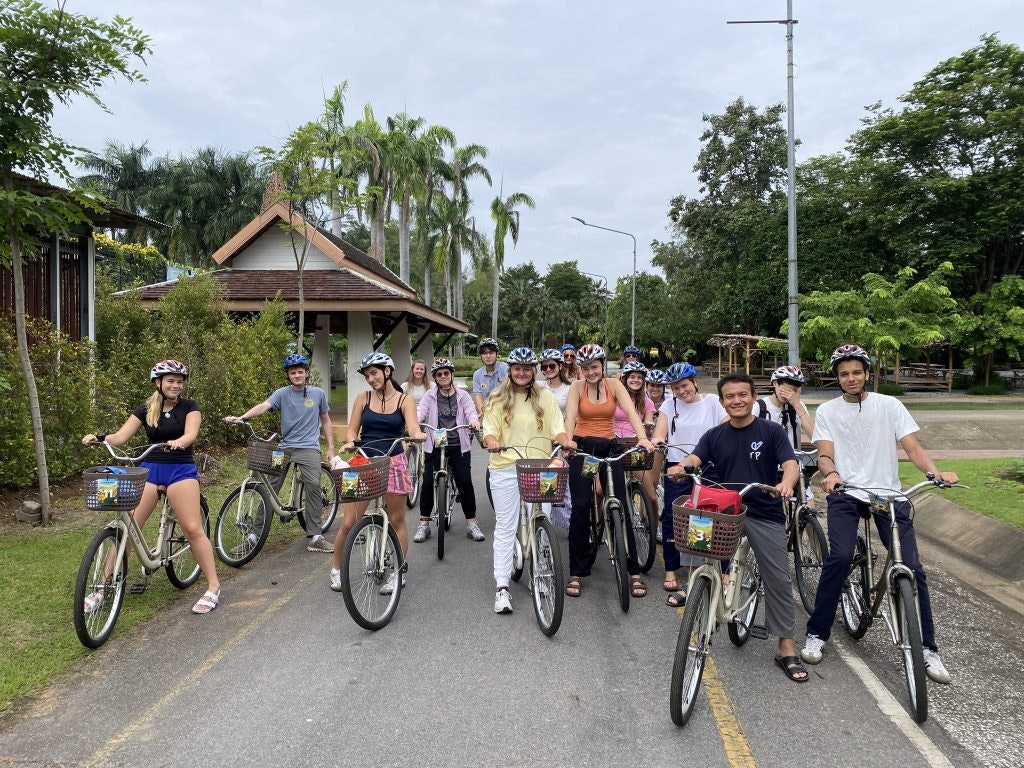 Rustic Pathways students and chaperones on a biking excursion in Thailand.