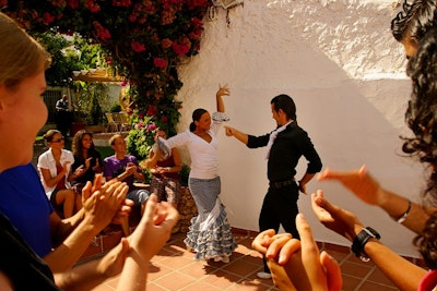 students watch a couple dance during a flamenco dance class on a spain teen tour