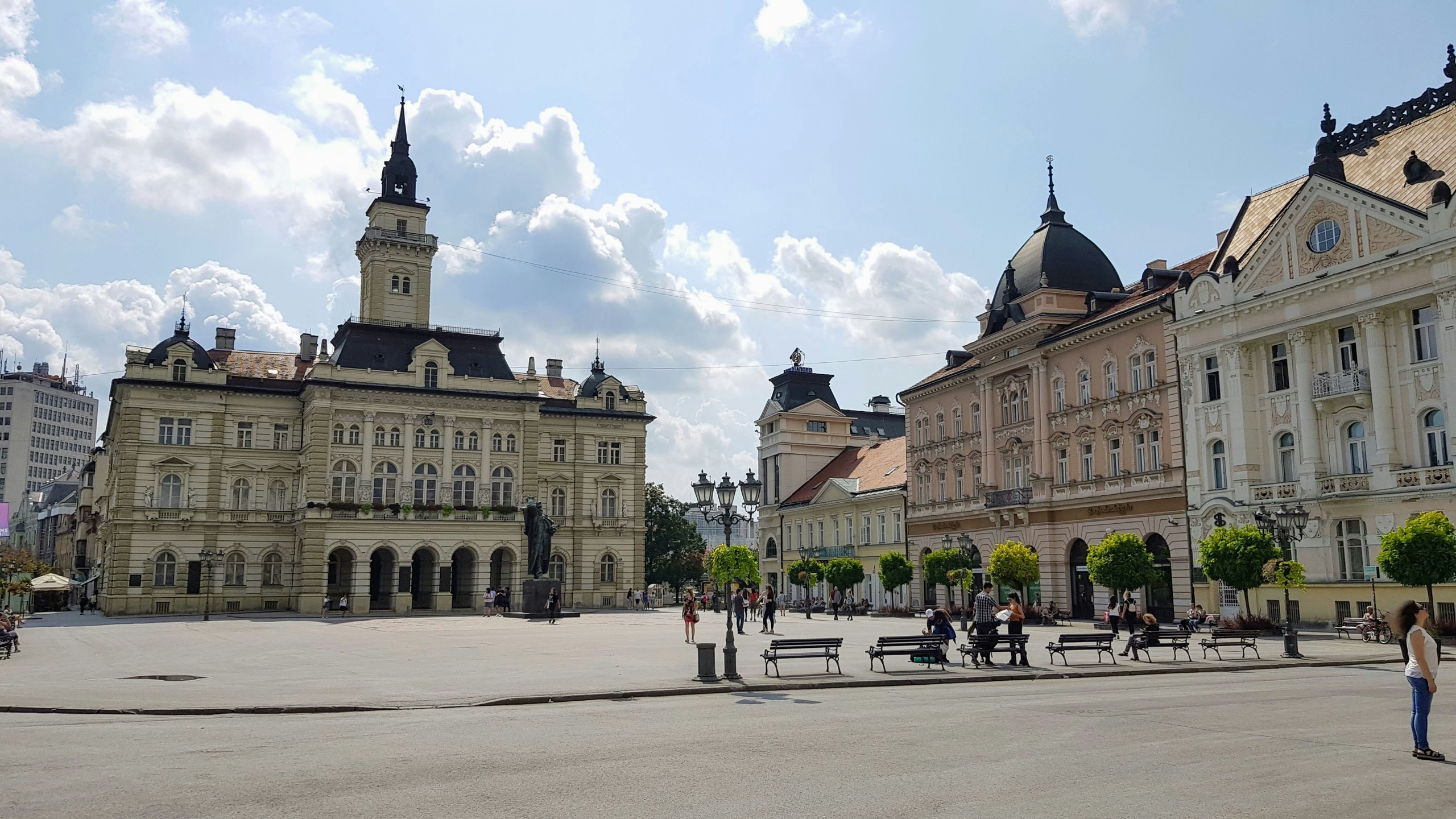 Novi Sad's Liberty Square, with the City Hall clock tower and ornate facades around the open paved square.