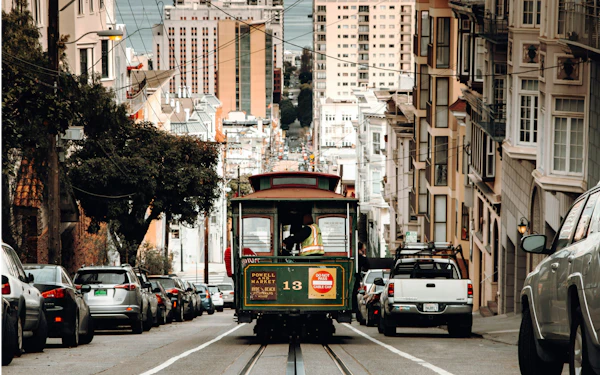 A San Francisco cable car on a steep city street.