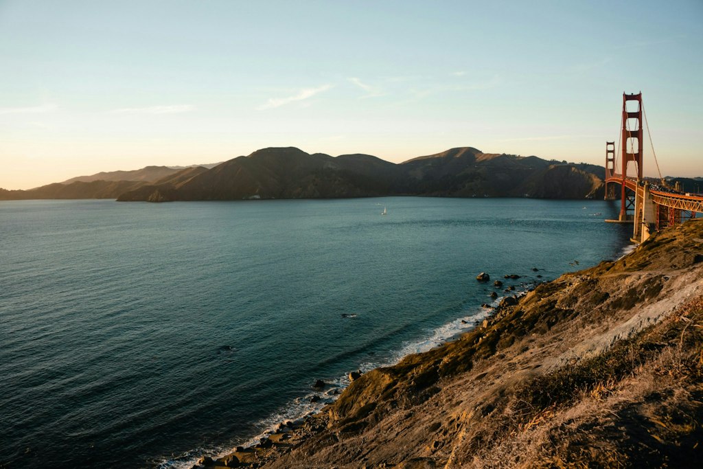 Landscape picture of the Golden Gate Bridge next to the sea. 