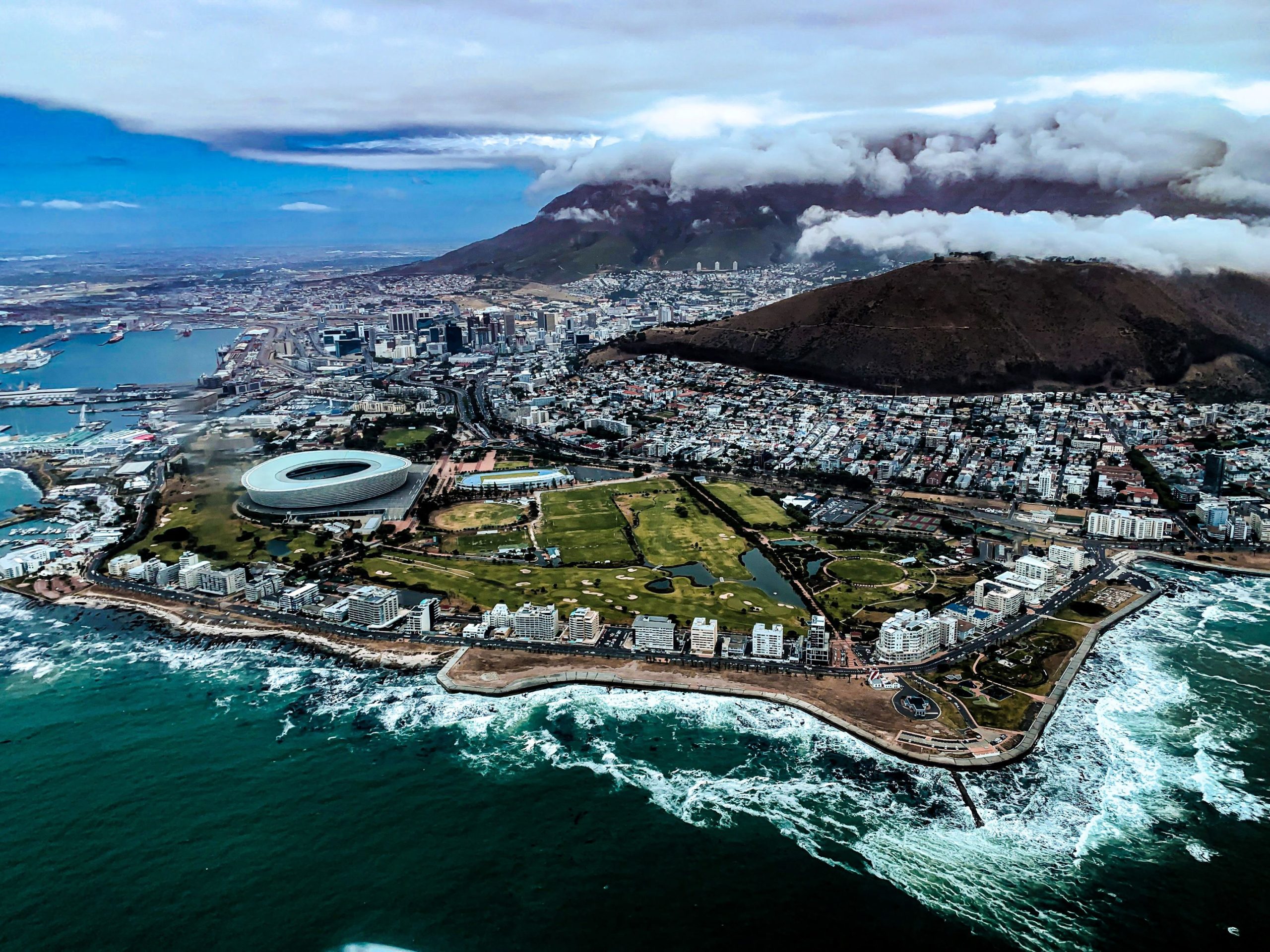 Aerial view of Cape Town's coastline with Table Mountain rising above the city