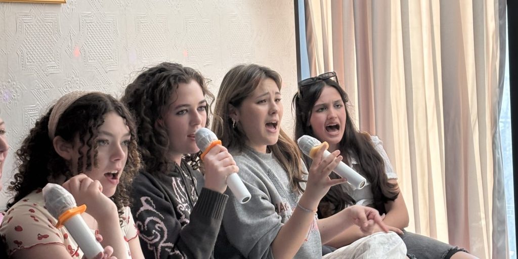 RUstic Pathways students singing Karaoke in Seoul during a South Korea teen tour.