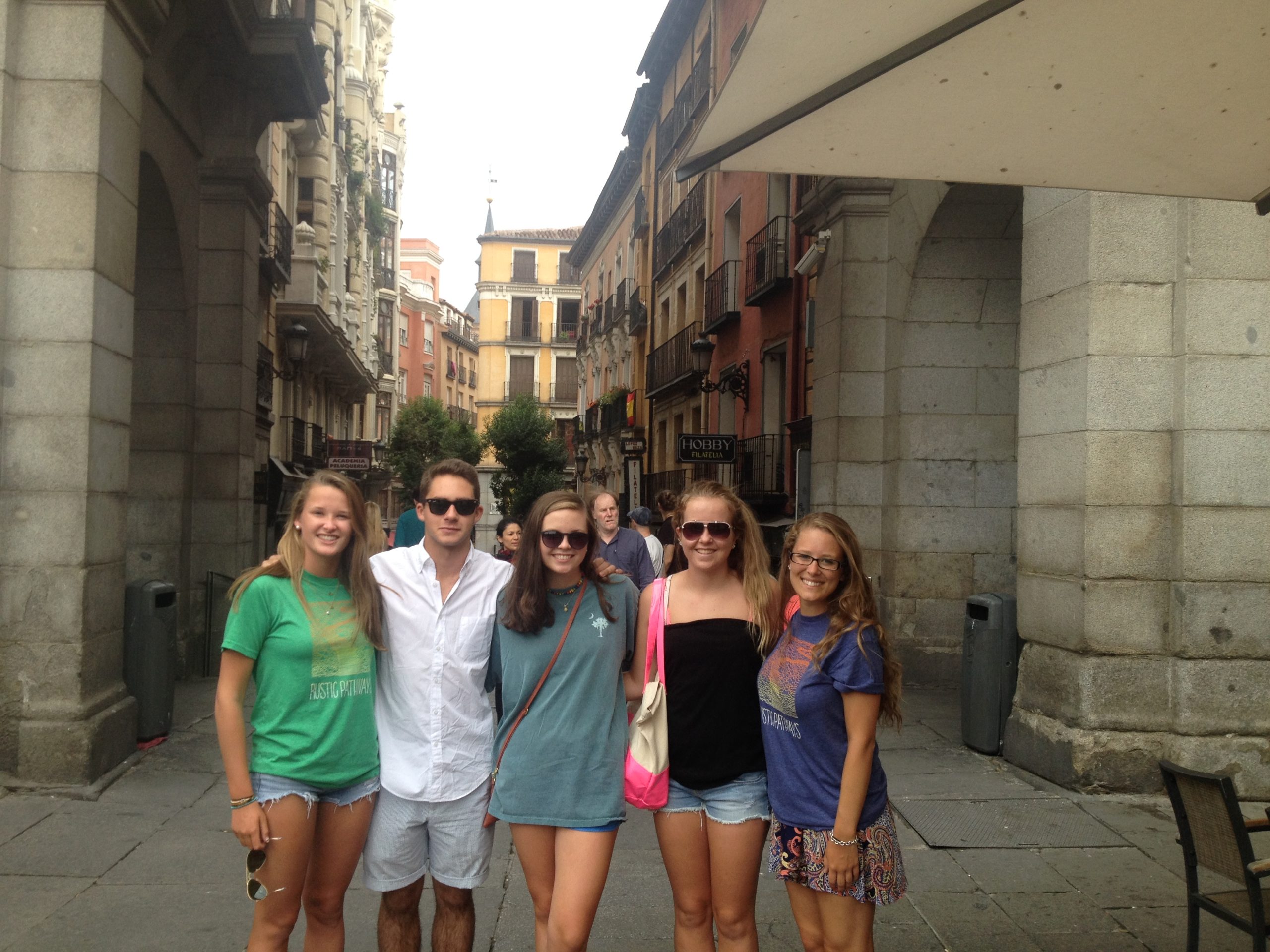 Student travelers posing in a town square during a Spain teen tour.