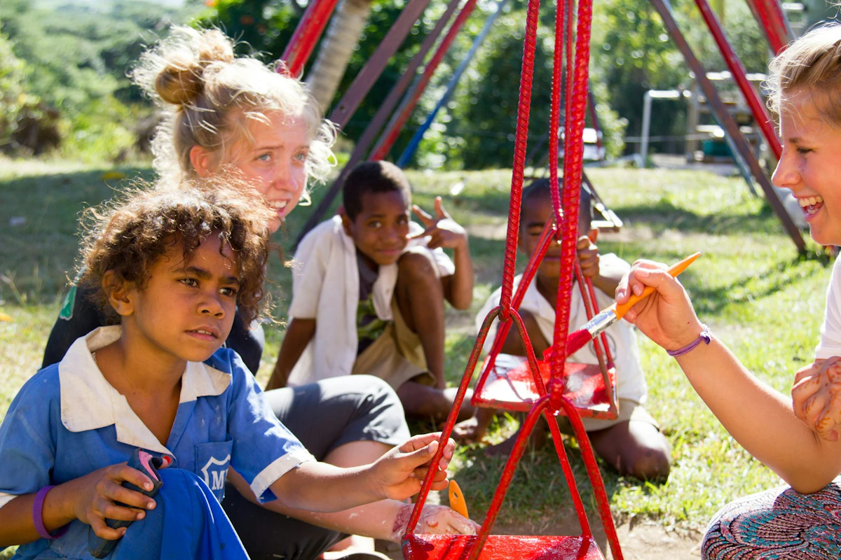 Rustic Pathways students working with community members on a service-learning project in Fiji