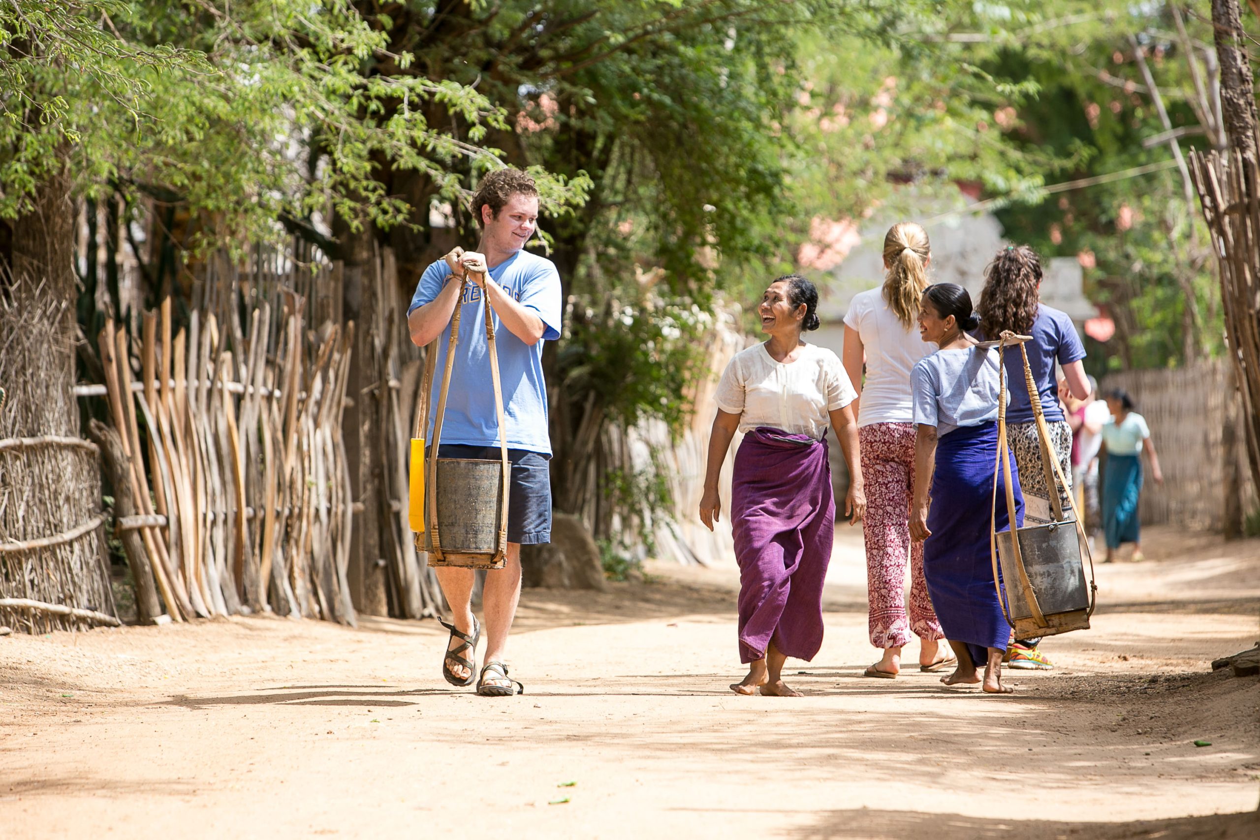 Group of students and instructor walking together in Thailand.