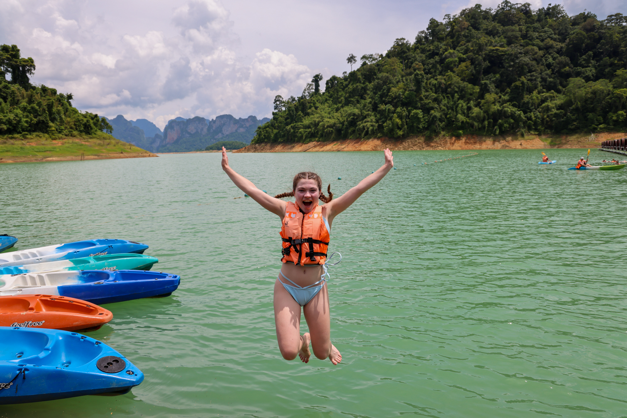 Student diving into water in Thailand.
