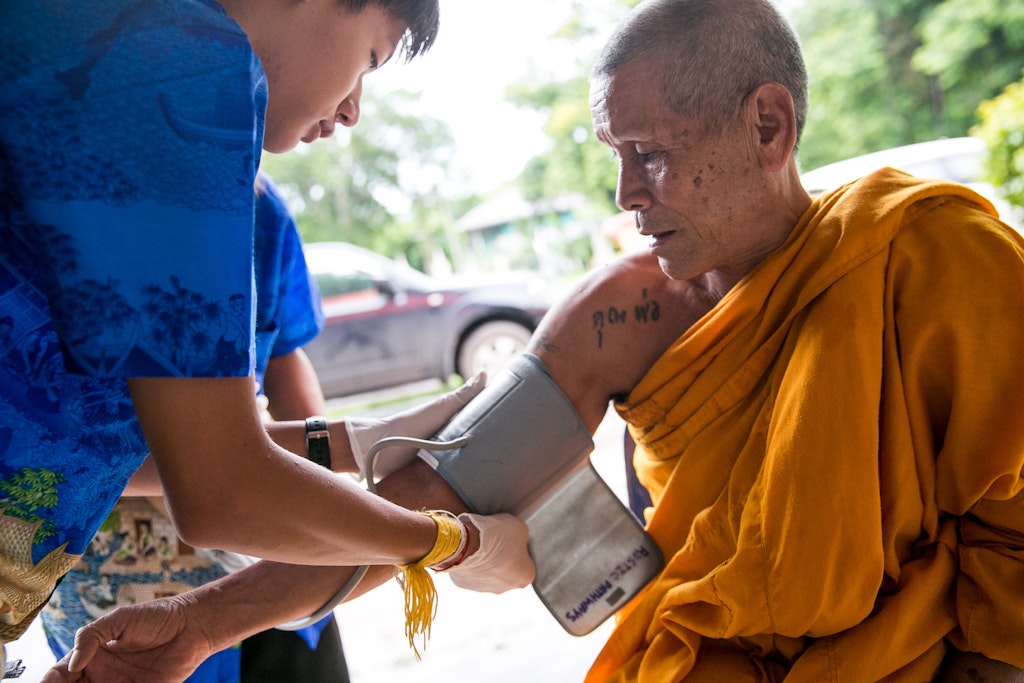 high school student performing community health service in Thailand critical issues