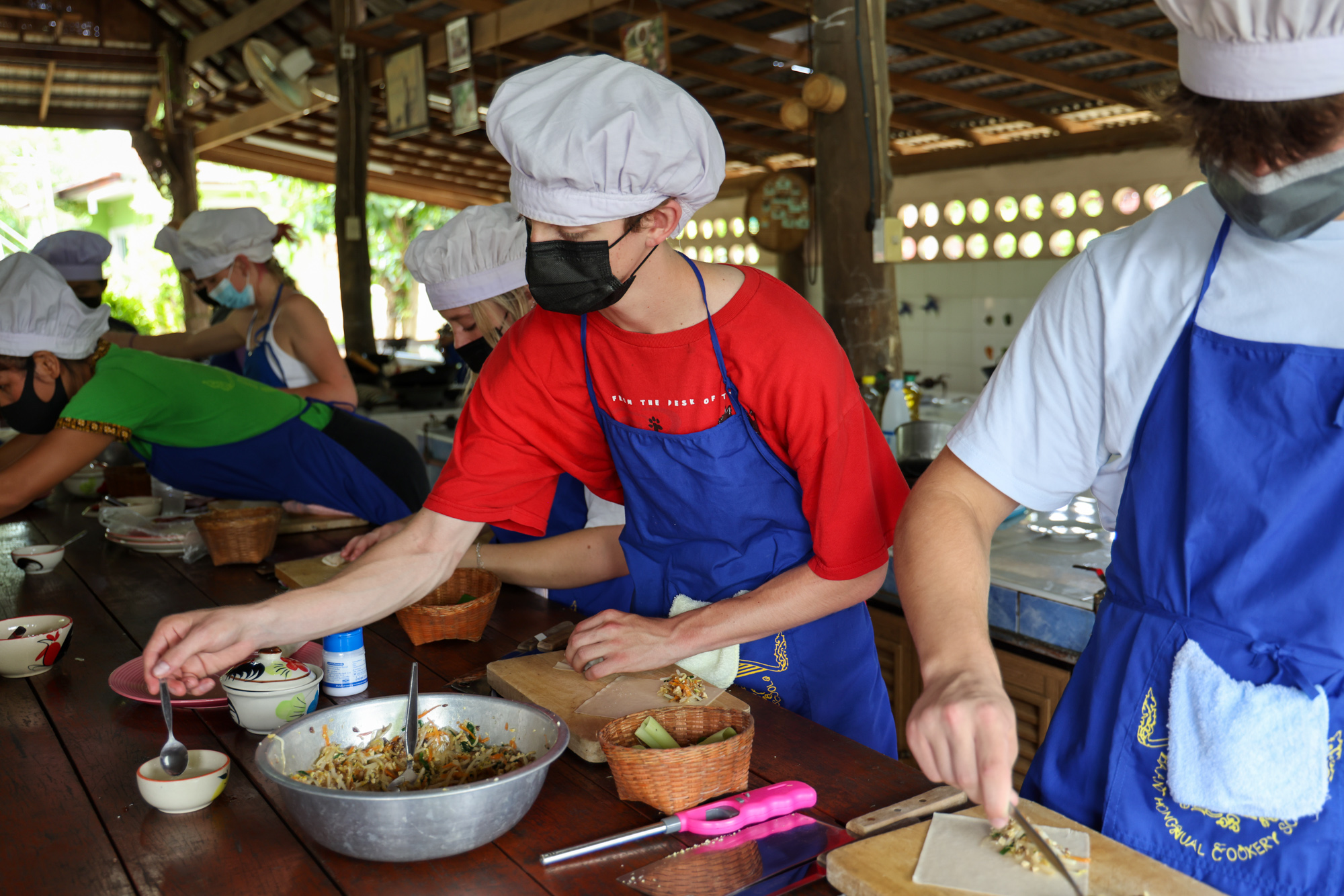 Students preparing a Thai meal together.