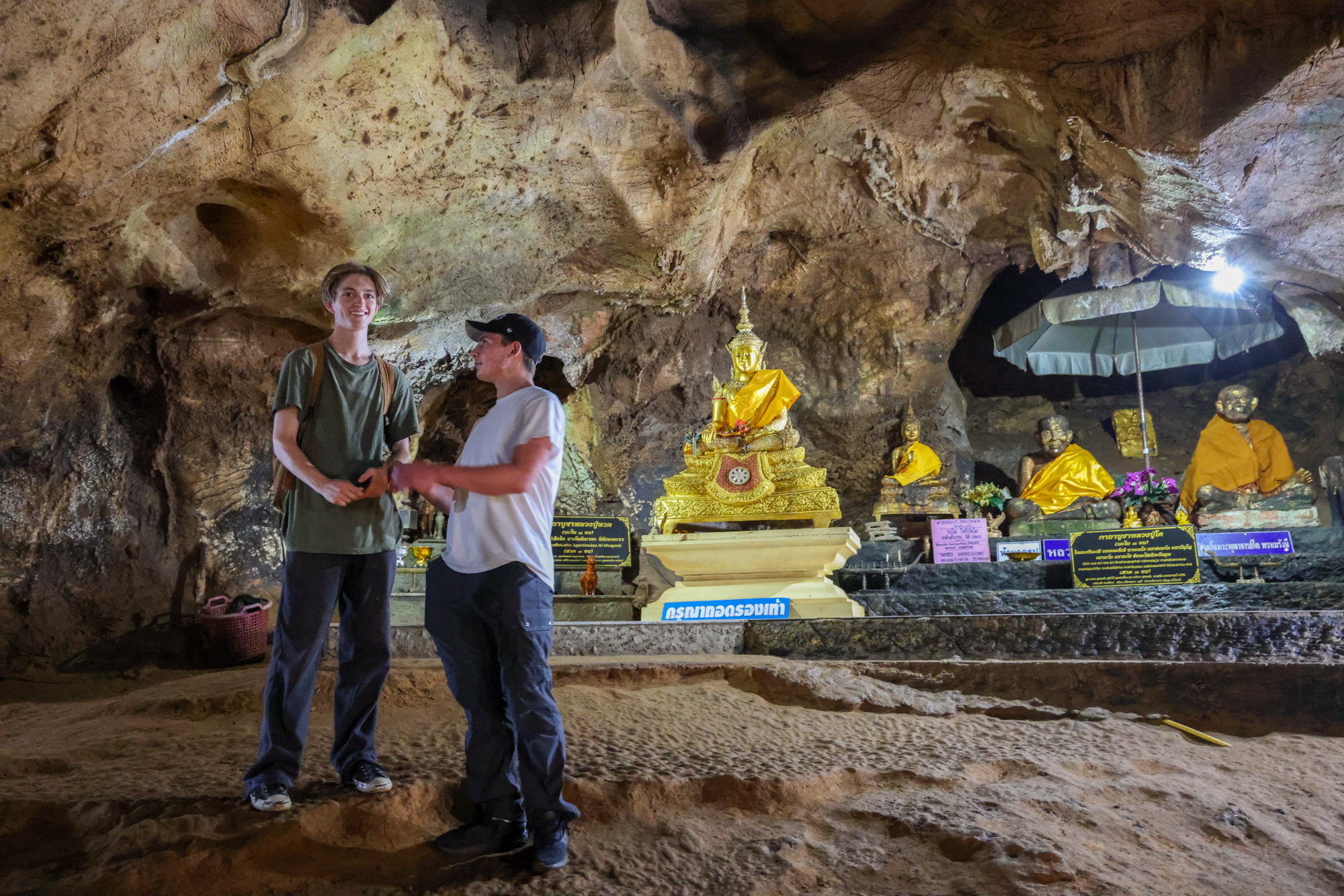 Students inside a cave in Thailand.
