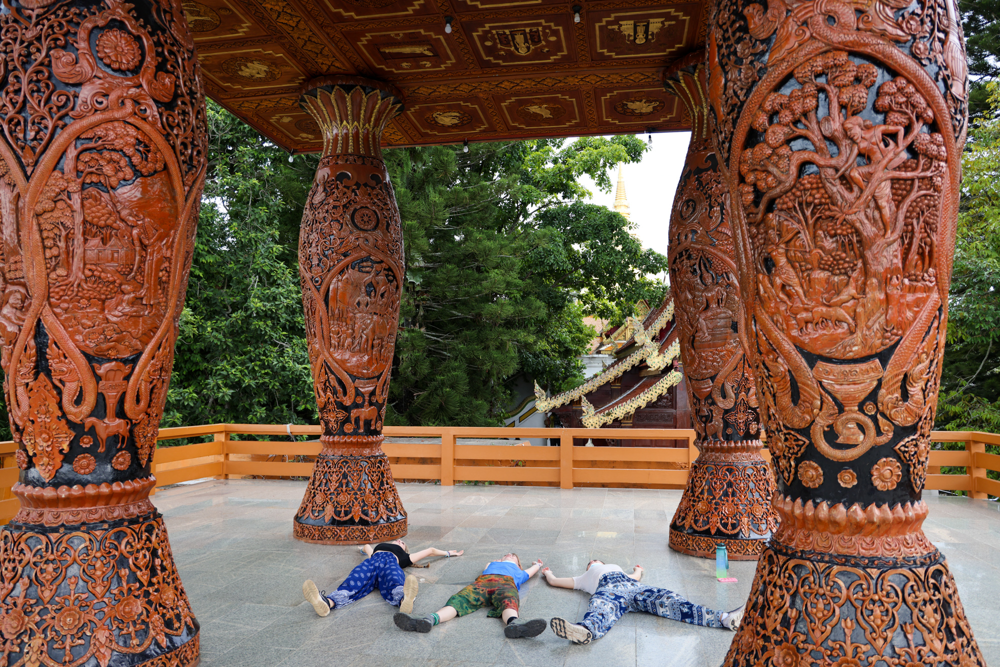 Students lying down in a palace in Thailand.