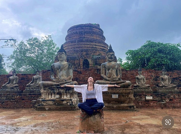 Rustic Pathways student Olivia Venneman visits Mahathat Temple in Ayutthaya, Thailand.