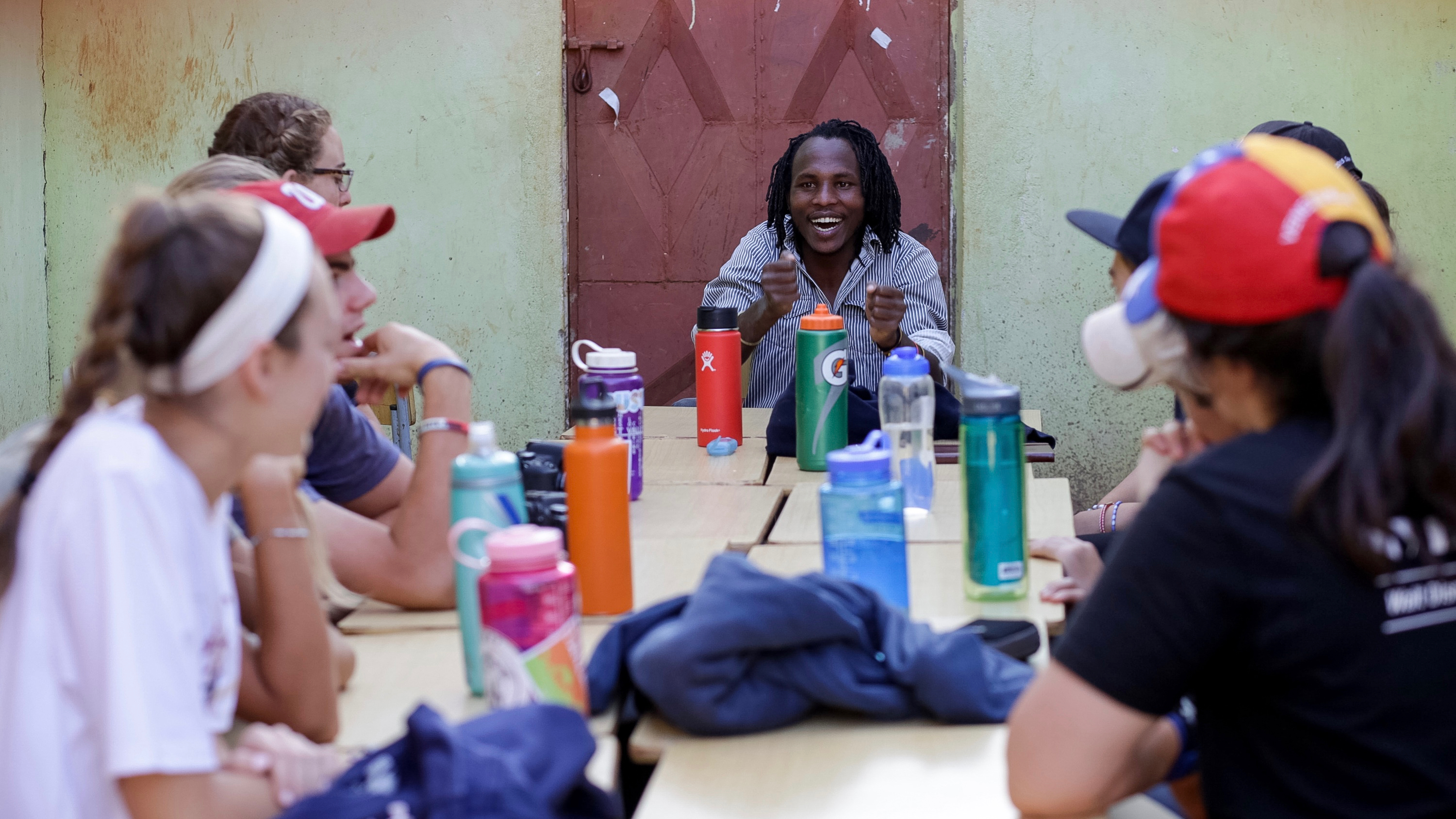 Rustic Pathways Program Leader Jackson hosts a discussion with students in Tanzania