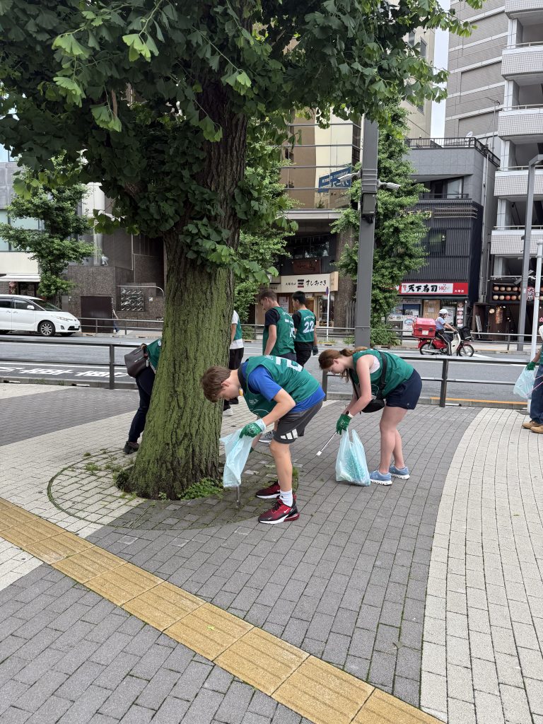 Students participating in a community cleanup in Japan