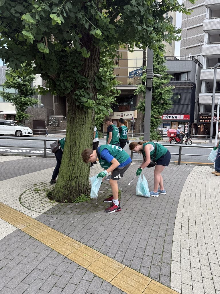Students participating in a community cleanup in Japan