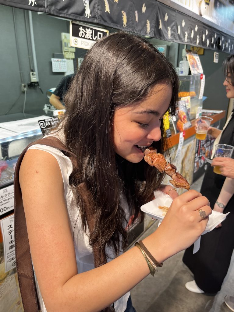 Students eating at a Japanese market