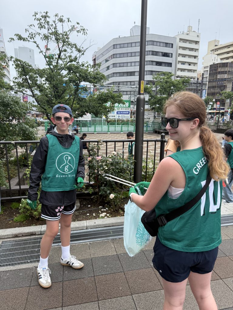 Students participating in a neighborhood cleanup in Japan.