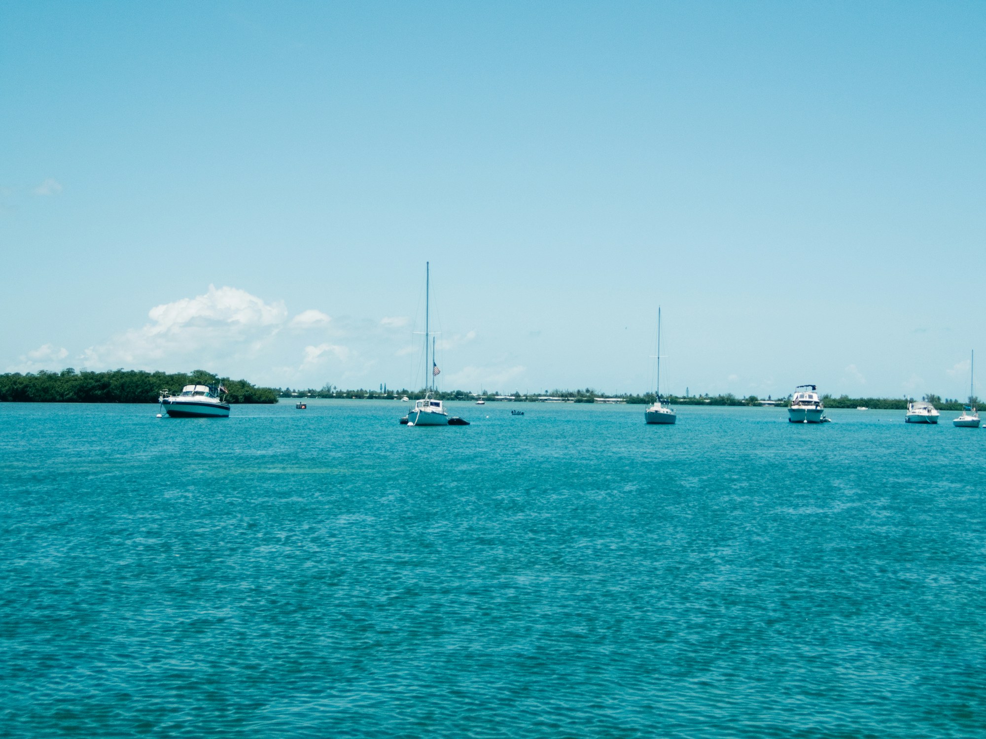 Small boats moored in the shallows off the Florida Keys.