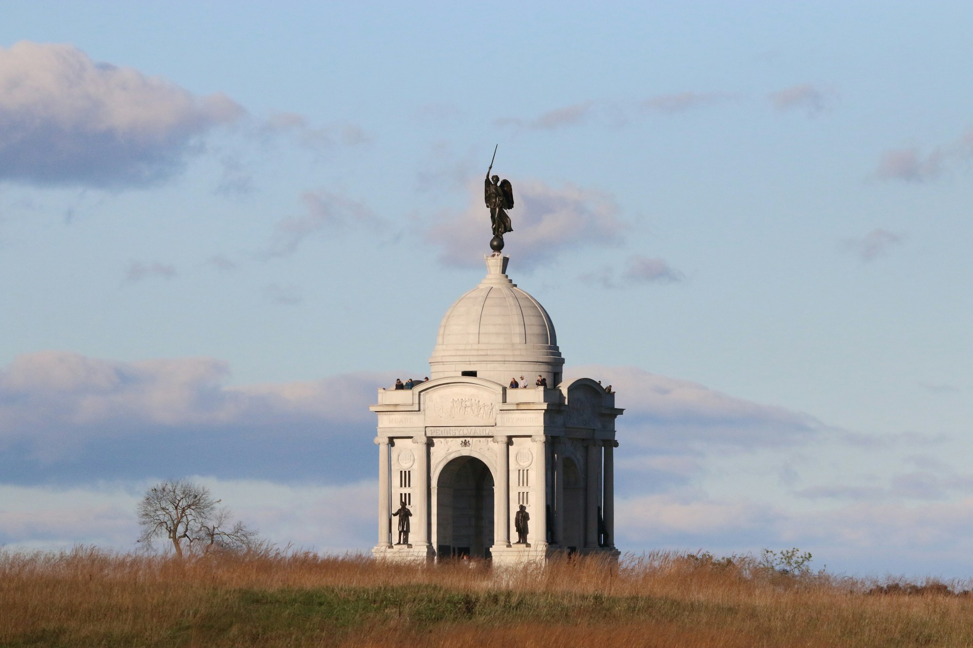 A domed state memorial standing on a ridge at Gettysburg.
