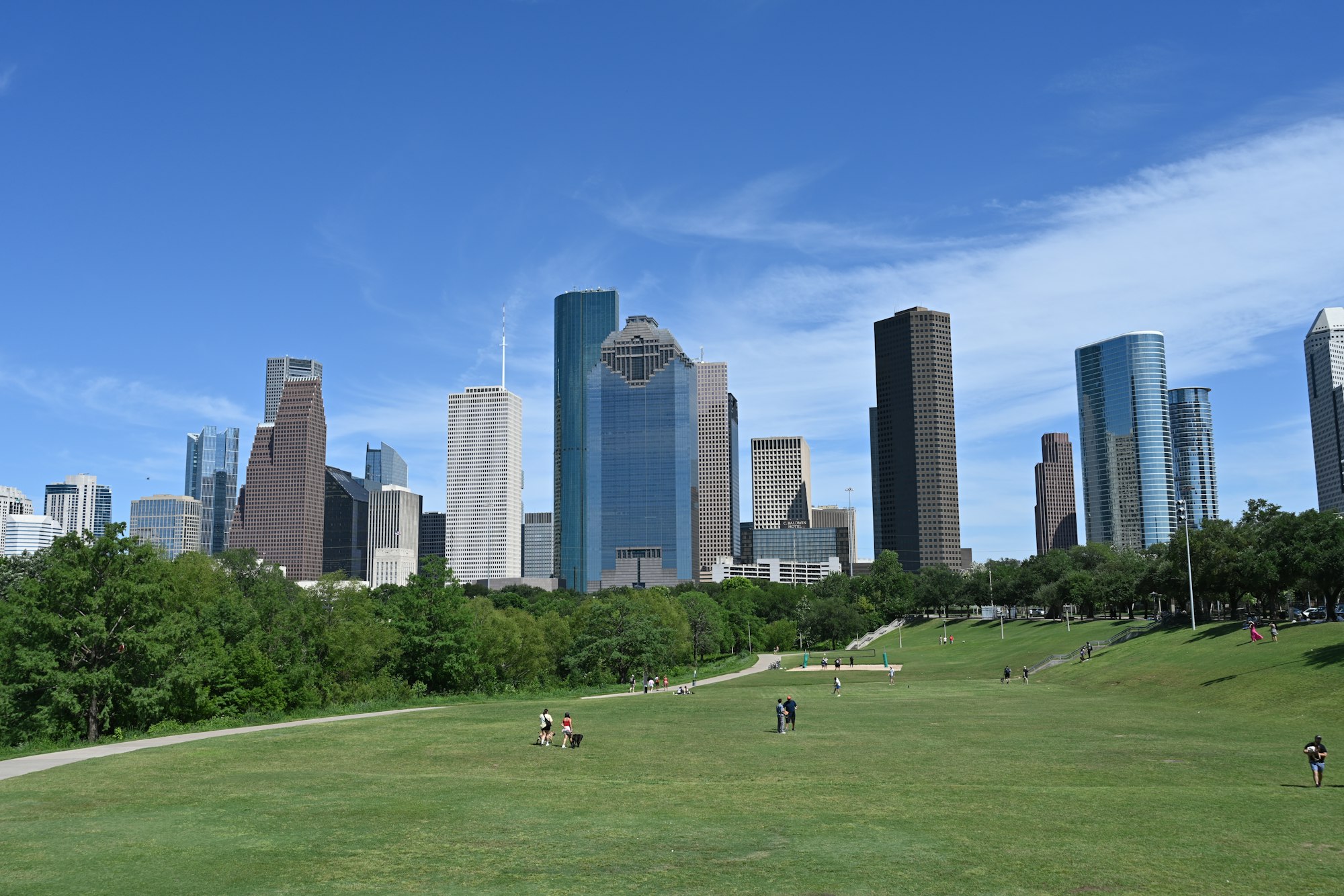 The Houston skyline seen across parkland on a clear day.