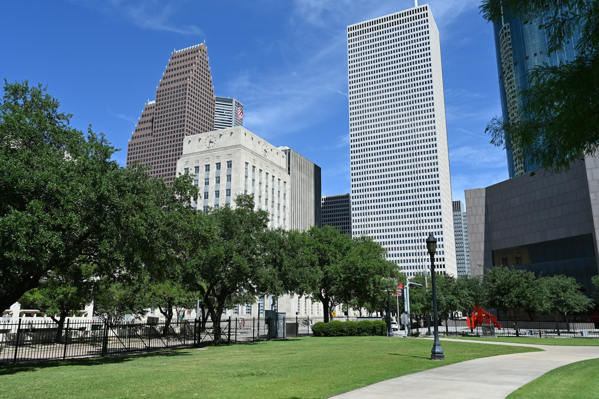 A downtown Houston park with the office towers behind it.