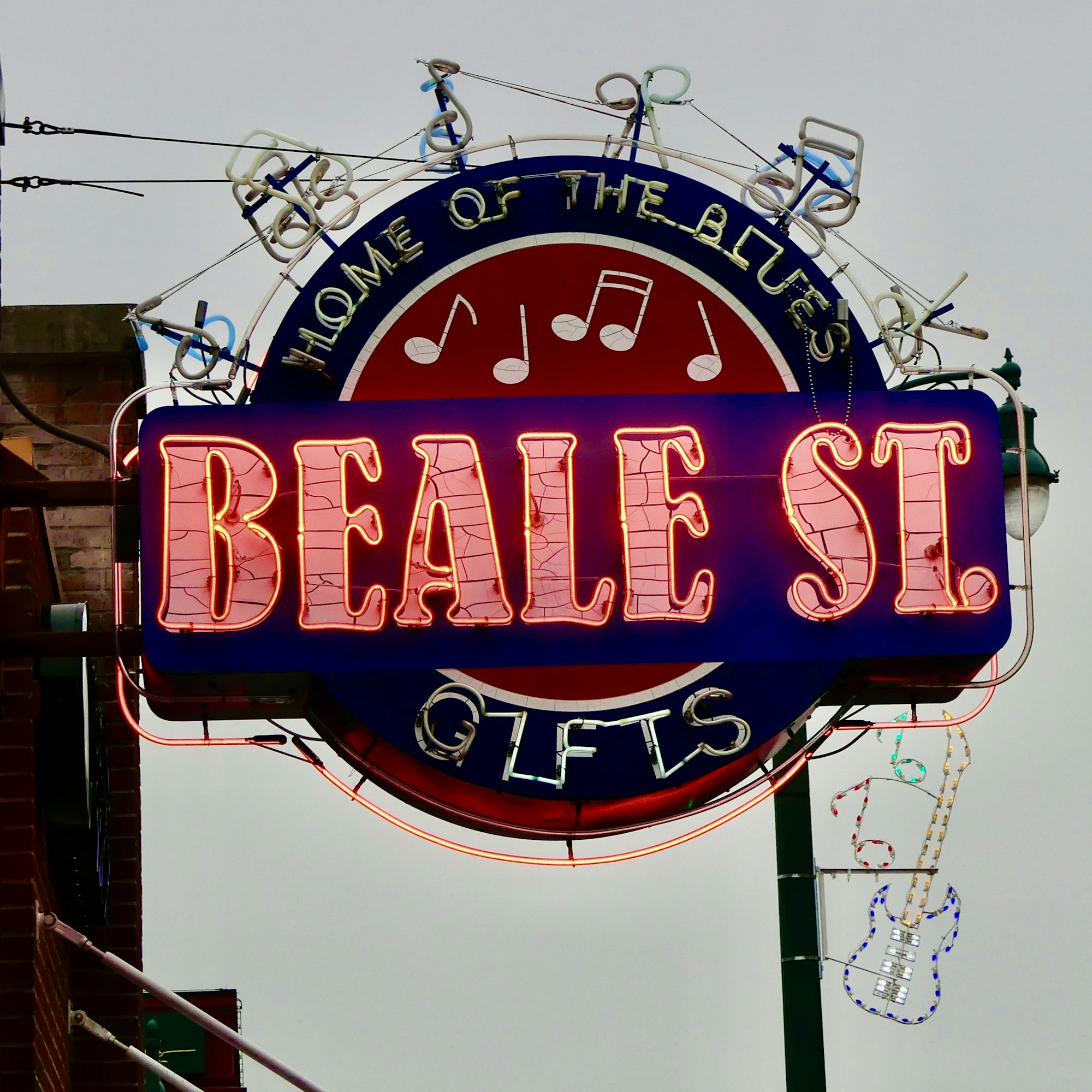 A neon Beale Street sign in a Memphis shop window.
