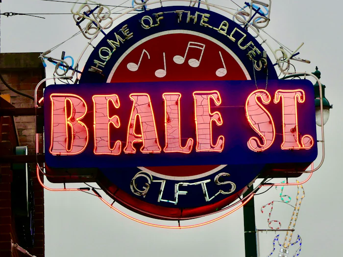 A neon Beale Street sign in a Memphis shop window.