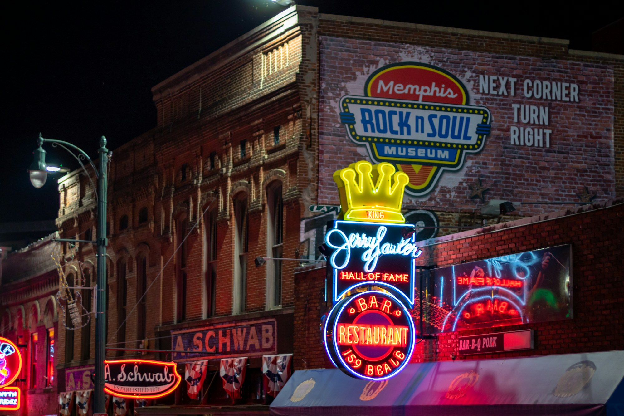 Museum and club signage along Beale Street in Memphis.