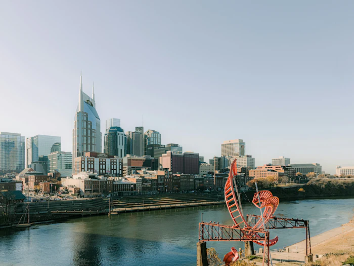 The pedestrian bridge over the Cumberland with the Nashville skyline behind it.