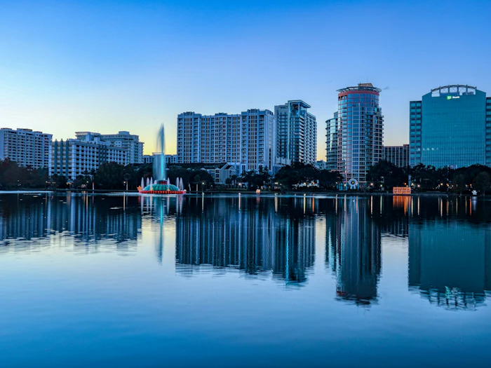 Lake Eola Park and the Orlando skyline at sunrise.