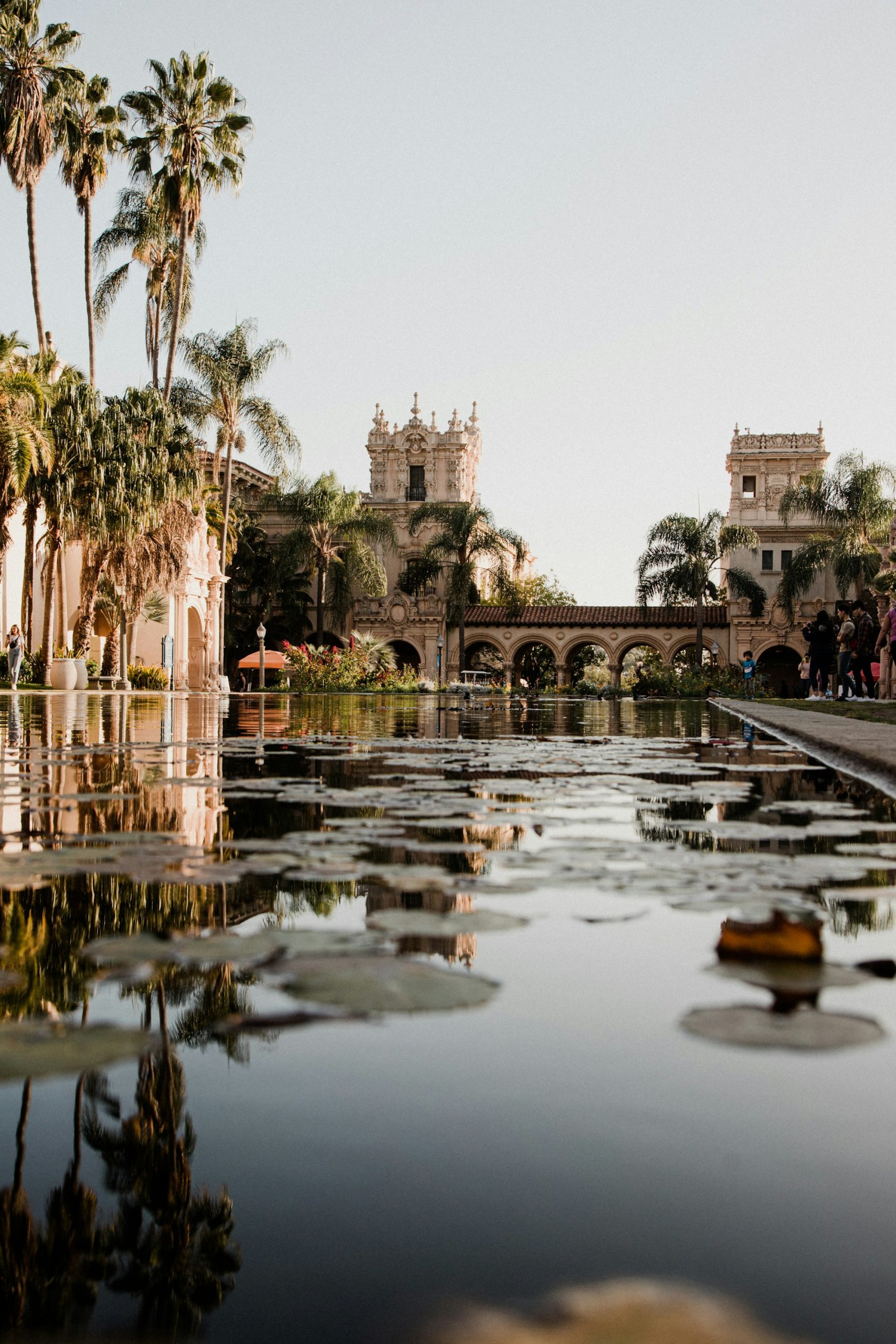 Balboa Park’s arcaded architecture and lily pond beside its gardens.