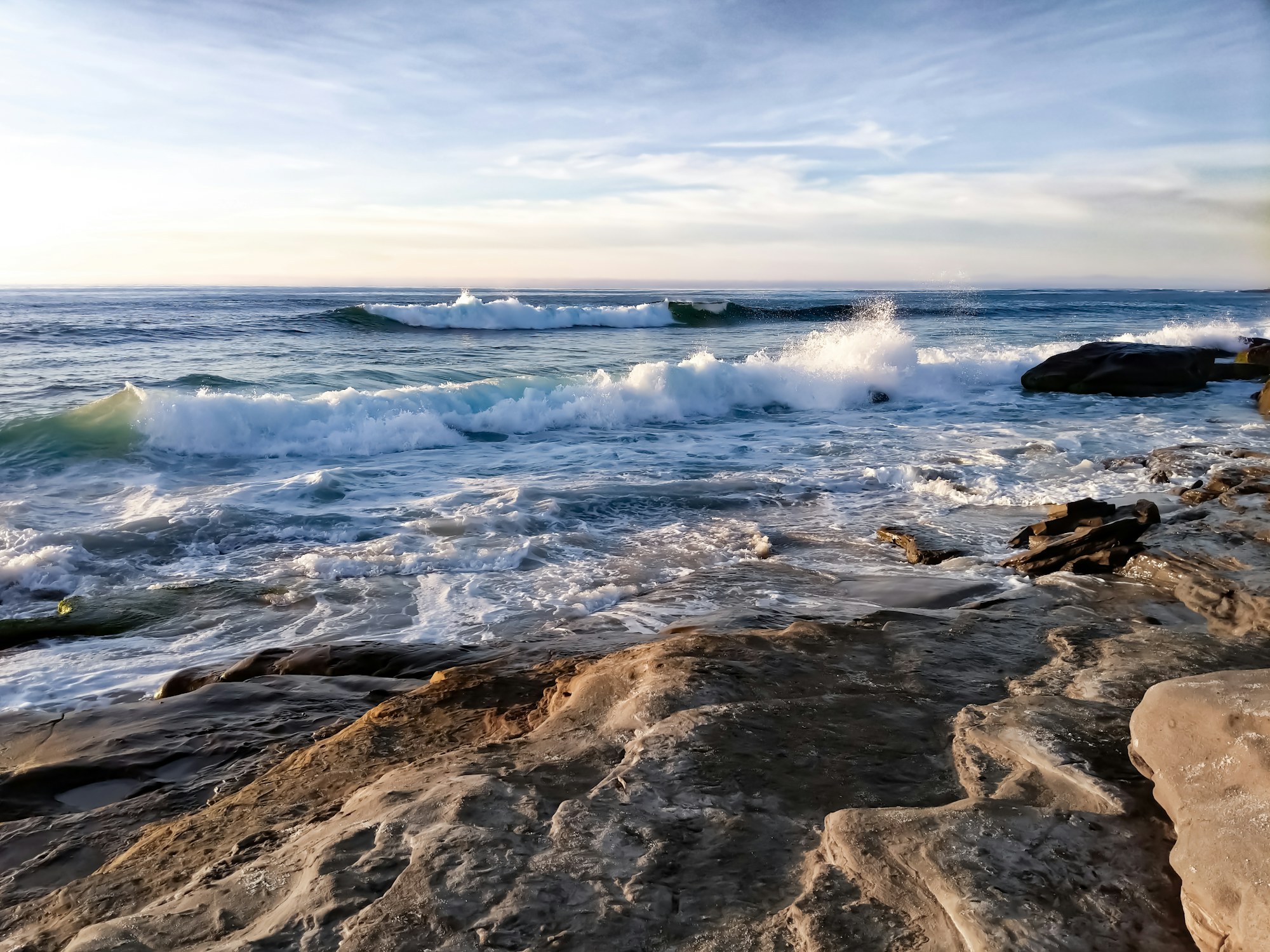 Waves breaking on the rocks at La Jolla, California.