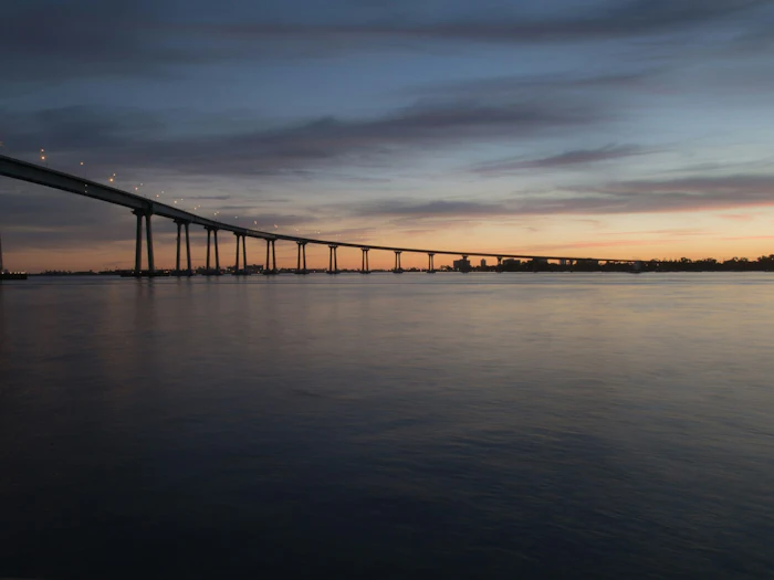 The Coronado Bridge across San Diego Bay at dusk.