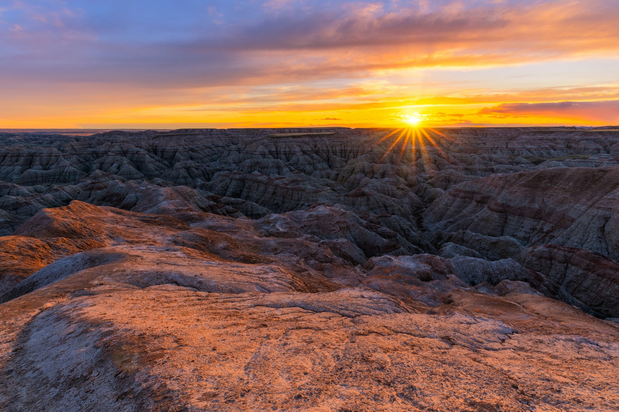 Sunrise over the eroded formations of Badlands National Park.
